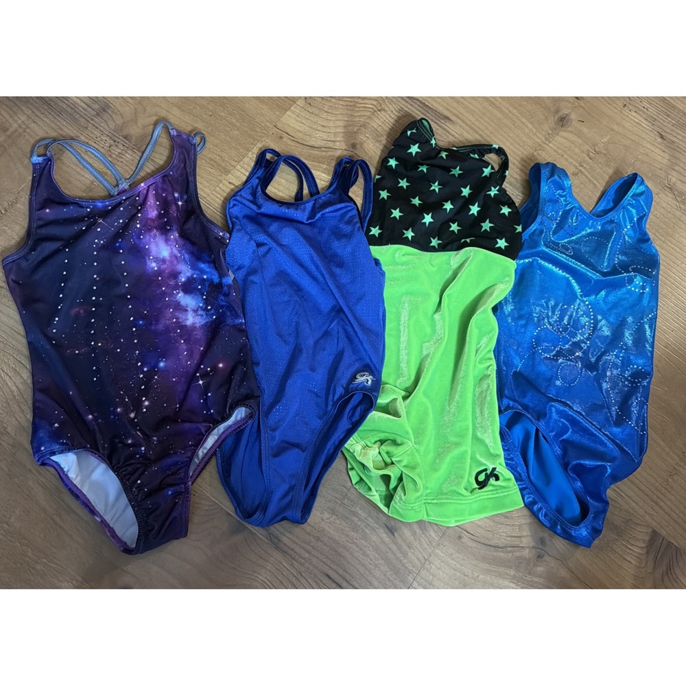 4 Gymnastics leotards great condition CHILD med.  CM, GK elite (2), Destira (1)